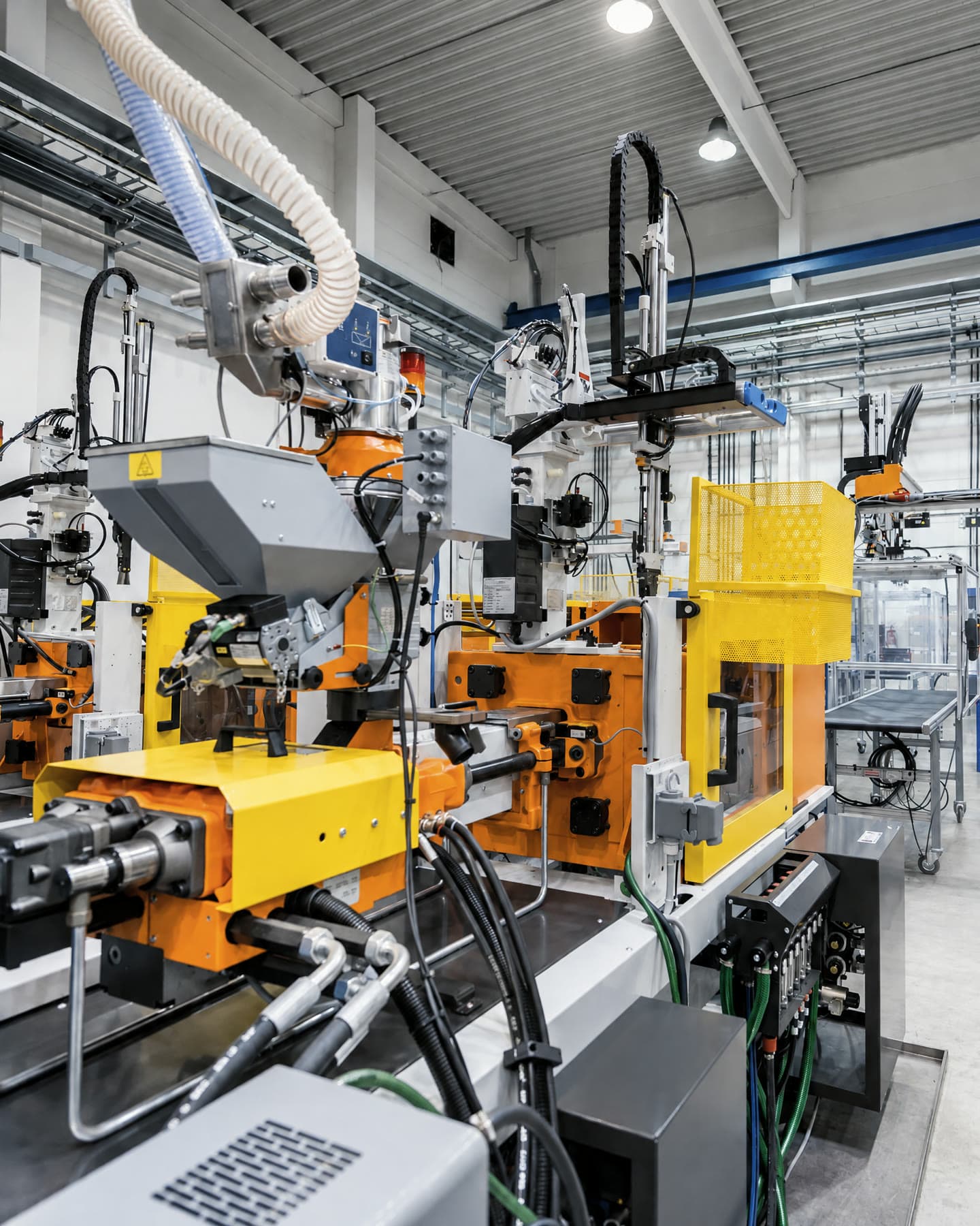 Plastic injection moulding machines on a factory floor